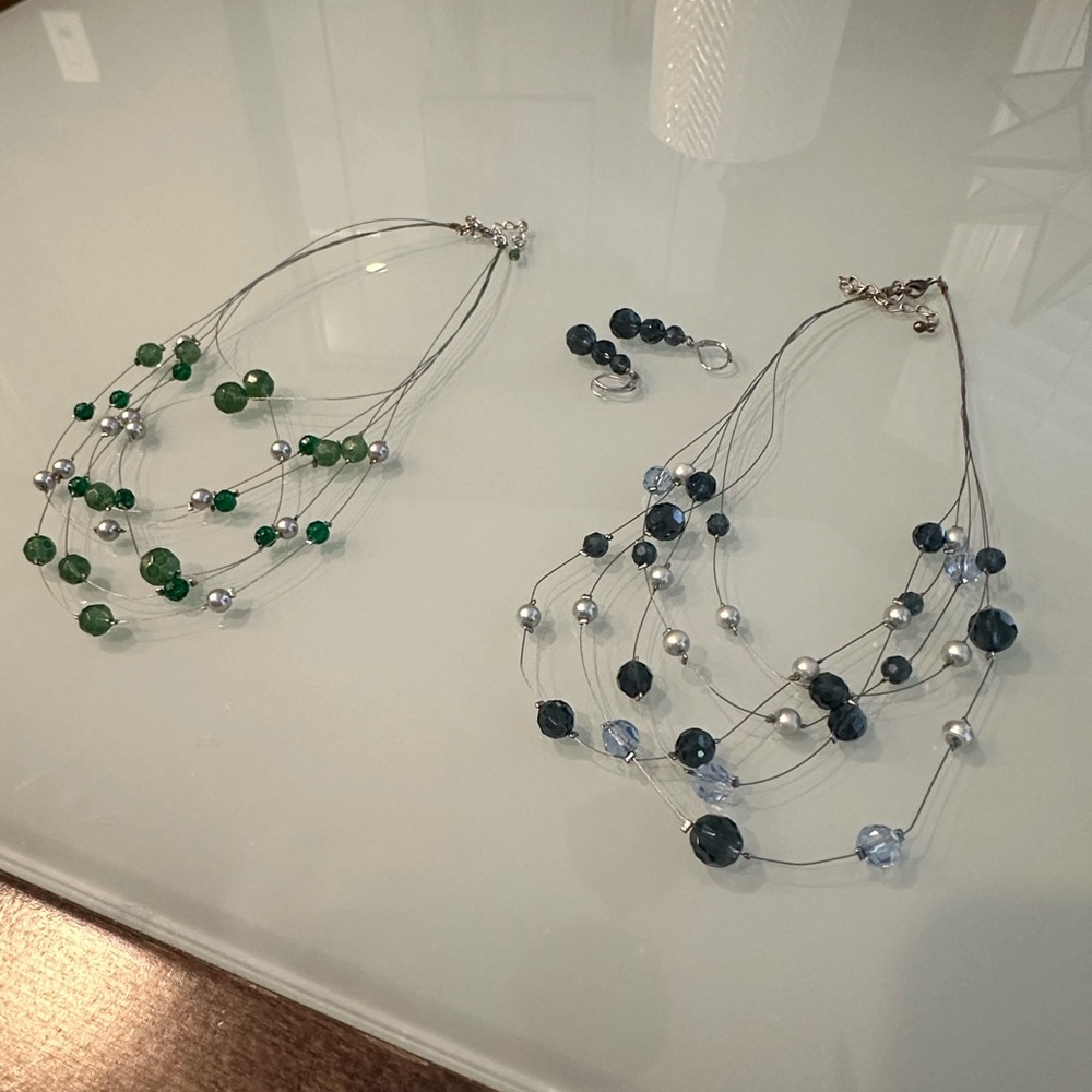 Two necklaces and one pair of earrings